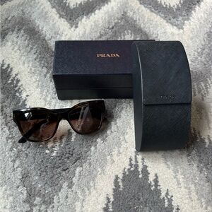 Prada tortoise shell cat eye sunglasses.